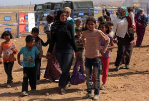 Syrian refugees, mostly Kurds from Kobani, arrive at …
