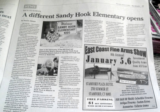 This handout photo shows an ad for a gun show adjacent to an article about the Newtown, Conn. school shooting in the Thursday, Jan. 3, 2013 edition of The Advocate of Stamford, Conn. A statement released Thursday by Hearst Connecticut Media Group's publisher Paul Farrell said the ad's placement was an oversight. (AP Photo)