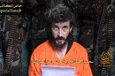 FILE- In this undated file image from a video posted on islamic militant websites and made available Wednesday June 9 2010, a man identified as French security agent Denis Allex pleads for his release from the Somali militant group al-Shabaab who have been holding him for nearly a year. A French commando raid in Somalia to free a captive intelligence agent ended in the deaths of 17 Islamists and a French soldier. France said the hostage also died in the failed rescue, but the man's captors denied he had been killed and claimed Saturday, Jan. 12, 2013, to have seized a second soldier. (AP Photo, File)