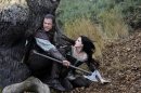 This film image released by Universal Pictures shows Chris Hemsworth, left, and Kristen Stewart in a scene from "Snow White and the Huntsman". (AP Photo/Universal Pictures, Alex Bailey)