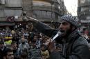 A member of the Islamic State of Iraq and the Levant (ISIL) urges people to join the fight against the regime, in the northern Syrian city of Aleppo on November 13, 2013
