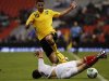 Jamaica's McAnuff fights for the ball with Mexico's Rodríguez during their 2014 World Cup qualifying soccer match in Mexico City