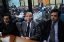 Ex-Argentinian President Carlos Menem (C) listens to his sentence during his trial in Buenos Aires, September 13, 2011