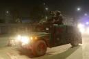 Afghan policemen arrive at the site of a Taliban attack in the Afghan capital of Kabul