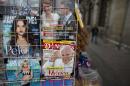 A magazine cover welcoming Pope Francis to Mexico is displayed for sale alongside fashion and gossip magazines at a newsstand in Mexico City, Wednesday, Feb. 10, 2016. The pontiff will arrive to Mexico on Friday, Feb. 12 for a week-long visit. (AP Photo/Rebecca Blackwell)
