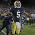 Notre Dame quarterback Everett Golson celebrated after scoring the winning touchdown in the the third overtime period against Pittsburgh in an NCAA college football game in South Bend, Ind., Saturday, Nov. 3, 2012. Dame defeated Pittsburgh 29-26 in triple overtime. (AP Photo/Michael Conroy)