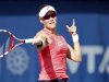 Stosur of Australia hits a return to Vinci of Italy during their women's singles quarter-final match at the WTA Dubai Tennis Championships