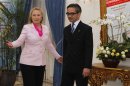 U.S. Secretary of State Hillary Clinton gestures next to Indonesia's Foreign Minister Marty Natalegawa during their meeting in Jakarta
