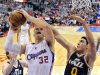 Los Angeles Clippers forward Blake Griffin, left, goes up for a shot as Utah Jazz center Enes Kanter, of Turkey, defends during the first half of an NBA basketball game, Sunday, Dec. 30, 2012, in Los Angeles. (AP Photo/Mark J. Terrill)