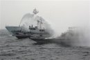 File photo of Japan Coast Guard patrol ship spraying water at a fishing boat carrying Taiwanese activists onboard while it heads for the disputed islands in the East China Sea islets