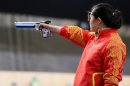 Guo Wenjun takes aim during Sunday's competition