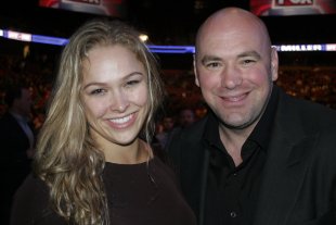 Dana White and Ronda Rousey pose during a UFC event. (Getty)