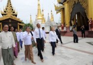 US President Barack Obama (C) and US Secretary of State Hillary Clinton are escorted around the grounds as they visit the Shwedagon pagoda in Yangon, on November 19. Huge crowds greeted Obama in Myanmar on the first visit by a serving US president to the former pariah state