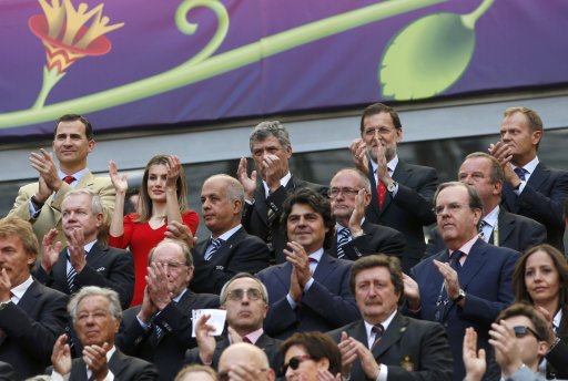 Spain's Crown Prince Felipe, Princess Letizia, Spain's Prime Minister Rajoy and Poland's Prime Minister Tusk applaud at the start of their Group C Euro 2012 soccer match between Spain and Italy in Gdansk