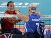 Martine Wright, left, of Britain  shakes hands with Larysa Klochkova left, of Ukraine, prior to their women' sitting volleyball match at the 2012 Paralympics games, Friday, Aug. 31, 2012, in London. On July 7, 2005, four suicide bombers detonated explosives on London’s transit system, killing 52 commuters and the four attackers. Wright was among the injured on 7/7, losing both her legs. Seven years later, she’s been transformed into an athlete, a Paralympian.(AP Photo/Alastair Grant)