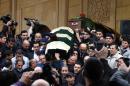 The coffin of former Lebanese finance minister Mohammad Shatah (Chatah) and that of his body guard (behind), are carried out of the Mohammed al-Amin mosque during their funeral in downtown Beirut, on December 29, 2013