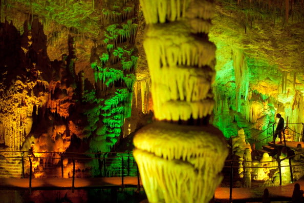 A visitor at the Sorek stalactites cave as it is illuminated with a new lighting system on August 9, 2012 near Beit Shemesh, Israel. The cave, 82 meters long and 60 meters wide, was discovered acciden