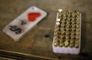 A case of bullets is seen next to an iPhone at the Los Angeles gun club in Los Angeles