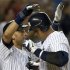 New York Yankees Derek Jeter congratulates Alex Rodriguez after his two-run home run against Tampa Bay Rays in MLB game in New York
