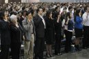 Immigrants take the oath of allegiance to the U.S. constitution during a naturalization ceremony in Los Angeles