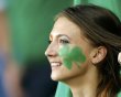 Ireland fan with an Irish clover painted on her face waits for the start of their Group C Euro 2012 soccer match against Croatia at the City Stadium in Poznan