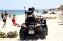 Tunisian security forces patrol a beach in Sousse, on July 1, 2015