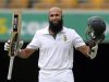 South Africa's Amla celebrates his century against Australia during the first cricket test match at the Gabba in Brisbane