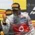 McLaren Formula One driver Hamilton celebrates his victory during the podium ceremony following the Canadian F1 Grand Prix at the Circuit Gilles Villeneuve in Montreal
