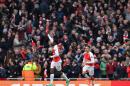 Arsenal's striker Danny Welbeck (L) celebrates scoring a goal during the English Premier League football match between Arsenal and Leicester at the Emirates Stadium in London on February 14, 2016