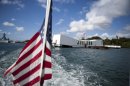 FILE - This Dec. 7, 2011 file photo shows the USS Arizona Memorial in Pearl Harbor, Hawaii. This popular site at Pearl Harbor is actually a grave, a resting place for crew members who died in the Pearl Harbor attack of Dec. 7, 1941. Visitors can see it on a first-come, first-serve basis, and many do to see a significant piece of history and pay respects to those who died. (AP Photo/Marco Garcia, file)