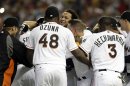 Miami Marlins' Henderson Alvarez, center, celebrates with teammates after pitching a no-hitter against the Detroit Tigers in an interleague baseball game on Sunday, Sept. 29, 2013, in Miami. The Marlins won 1-0. (AP Photo/Alan Diaz)