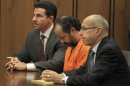 Ariel Castro, 52, sits with his head down between his attorneys Jaye Schlachet and Craig Weintraub during his pre-trial hearing in Cleveland