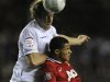 Leeds United's Becchio challenges Manchester United's Fryers during their English League Cup soccer match in Leeds