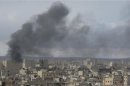 Smoke rises after what activists said was shelling by forces loyal to President Bashar al-Assad at Deir Al-Zor