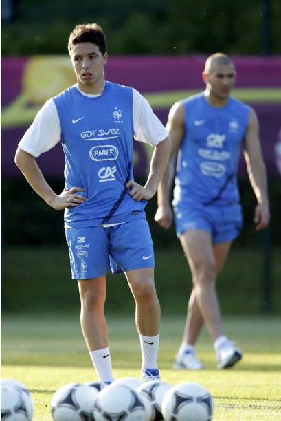 France's soccer players Nasri and Benzema attend a training session at the team's training center in Kircha near Donetsk during the Euro 2012