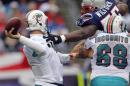 Miami Dolphins Richie Incognito tries to stop New England Patriots Vince Wilfork in their NFL football game in Foxborough