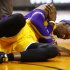 L.A. Lakers Dwight Howard falls to the court and grabs his right shoulder in pain in the 4th quarter of the game against the Phoenix Suns Wednesday Jan. 30, 2013.  The Lakers, who had won three straight _ all at home, lost Dwight Howard when he reinjured his right shoulder with 6:57 to play. (AP Photo/The Arizona Republic, Rob Schumacher)