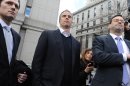 Michael Steinberg, center, exits Manhattan federal court with his attorney Barry Berke, Friday,March 29. 2013, in New York. A senior portfolio manager for SAC Capital Advisors, one of the largest U.S. hedge funds was arrested Friday, accused of making $1.4 million illegally in a widening insider trading probe involving an investment company founded by billionaire businessman Steven A. Cohen. (AP Photo/Louis Lanzano)