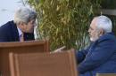 FILE - In this May 30, 2015, file photo, U.S. Secretary of State John Kerry, left, talks with Iranian Foreign Minister Mohammad Javad Zarif, in Geneva, Switzerland during talks on the future of the Iranian nuclear program. The United States and other nations negotiating a nuclear deal with Iran are ready to offer high-tech reactors and other state of the art equipment to Tehran if it agrees to crimp programs that can make atomic arms, according to a confidential document obtained Tuesday, June 22, 2015, by The Associated Press. (AP Photo/Susan Walsh, Pool, File)