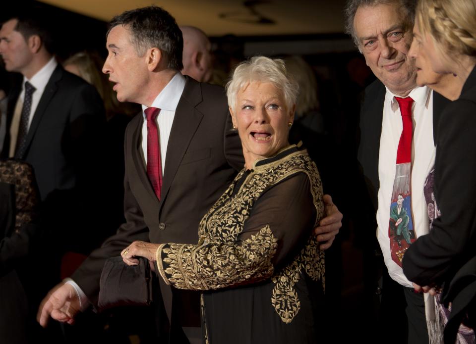 British actors Steve Coogan, left, and Judi Dench, second from left, arrive with British director Stephen Frears, second from right, for the screening of Philomena, as part of the 57th BFI London Film Festival, at a central London cinema, Wednesday, Oct. 16, 2013. (Photo by Joel Ryan/Invision/AP)