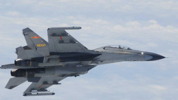 In this undated photo released by Japan Ministry of Defense, Chinese SU-27 fighter plane is shown. China and Japan are blaming each other for a close encounter between military jets over the East China Sea. China&#39;s defense ministry says Japanese F-15 fighters followed a Chinese TU-154 plane on regular patrol Wednesday, June 11, 2014 and got as close as 30 meters (100 feet). Japanese Defense Minister Itsunori Onodera said Wednesday that two Chinese SU-27 fighters had posed a danger to Japanese aircraft by flying near them. (AP Photo/Japan Ministry of Defense)