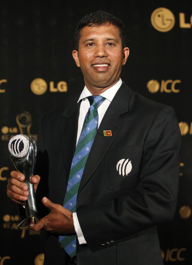 Sri Lanka's Dharmasena, winner of the ICC's Umpire of the Year Award, poses with the trophy during the ICC Awards in Colombo
