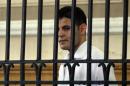 Egyptian policeman Mahmoud Salah Mahmoud stands in the dock during his trial in the Mediterranean city of Alexandria, on July 27, 2010