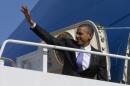 President Barack Obama waves he boards Air Force One at Andrews Air Force Base, Md., Friday, Feb. 14, 2014, en route to travel to Fresno, Calif., to discuss the ongoing drought. (AP Photo/Jacquelyn Martin)