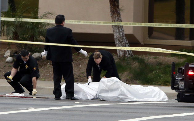 Orange County coroner's officials remove a body from the scene in Orange, Calif., Tuesday, Feb. 19, 2013. Police say a chaotic 25-minute shooting spree through Orange County left a trail of dead and injured victims before the shooter killed himself. Orange County sheriff's spokesman Jim Amormino say there are at least six crime scenes with three people, including the suspected gunman, dead and several others wounded. Tustin police Supervisor Dave Kanoti said the shootings started with an apparent carjacking just after 5 a.m. Tuesday in an unincorporated Ladera Ranch area of Orange County. (AP Photo/Jae C. Hong)