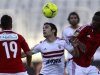 Ahmed Hassan of Egypt's Zamalek fights for the ball with Egypt's Al Ahly Abdallah El Said and Oussou Konan during their CAF Champions League derby soccer match at Borg El Arab "Army Stadium"