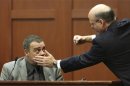 Prosecutor de la Rionda demonstrates a possible scenario while questioning witness Sanford police officer Serino at Zimmerman's second degree murder trial in Seminole circuit court in Sanford