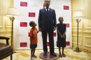 Orion and Omarion Hicks-Bey stand next to wax figure of Rev Martin Luther King Jr., courtesy of�Madame Tussauds D.C., on display in lobby at Willard InterContinental Hotel in Washington