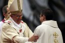 Pope Francis hugs a newly ordained priest during a ceremony in St. Peter's Basilica at the Vatican, Sunday, April 21, 2013. (AP Photo/Gregorio Borgia)