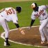 Baltimore Orioles Jones is welcomed by Wieters after his go-ahead, solo home run against the New York Yankees in Baltimore